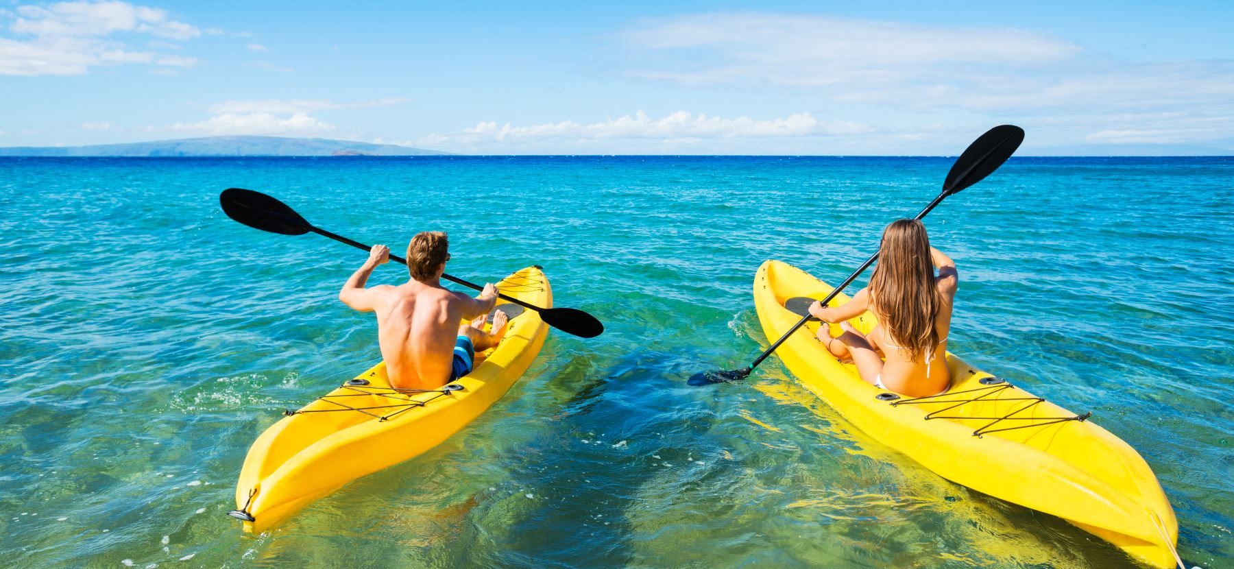 Couple Kayaking in the Ocean on Vacation