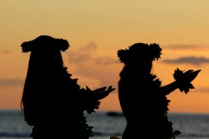 Hawaiian girls dancing the hula at sunset at Te Au Moana Show
