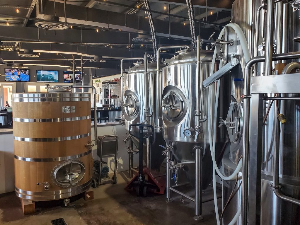 Large brewing tanks at Waikiki Brewing Company