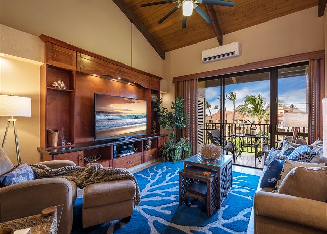 View of the living room with wooden and ocean decor