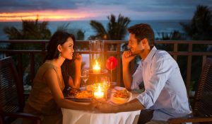 Romantic couple have dinner during their Maui Honeymoon
