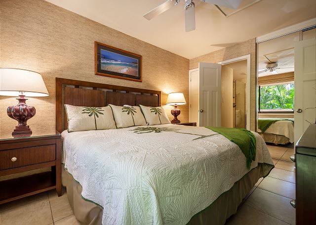 View of the plush bed and earthy decor in the bedroom