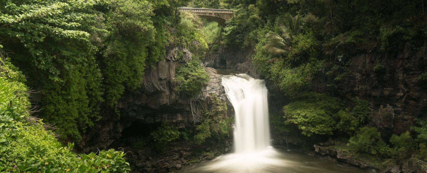 Waterfall under road bridge at Seven Sacred Pools Maui