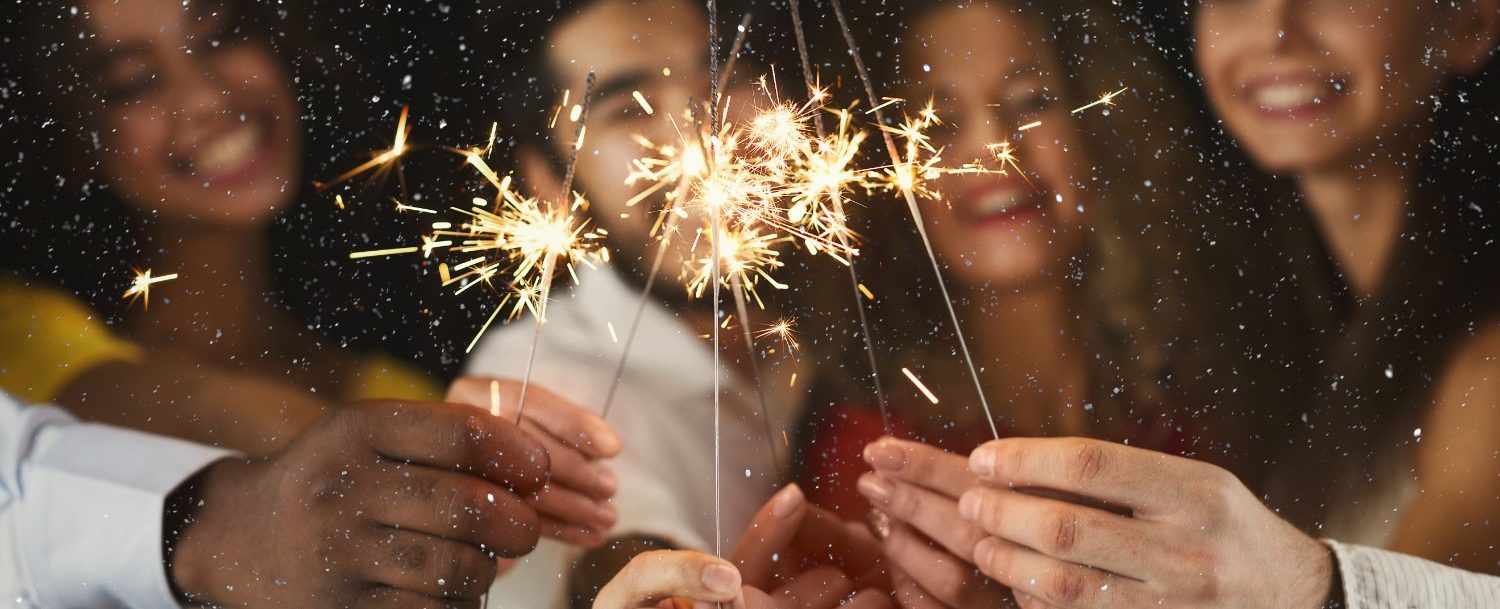 Friends with sparklers for New Years Eve on Maui