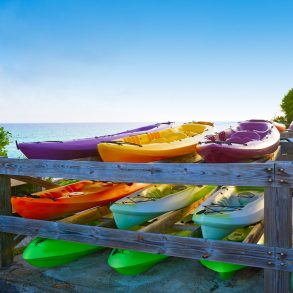 Maui Kayak Adventures | Row of colorful kayaks