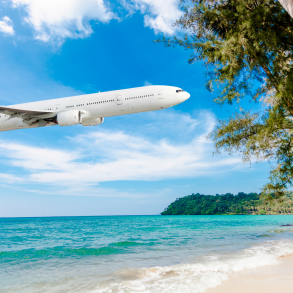 Commercial plane flying to a tropical destination