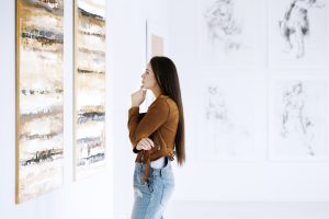 Woman Viewing Art at a Maui Art Gallery