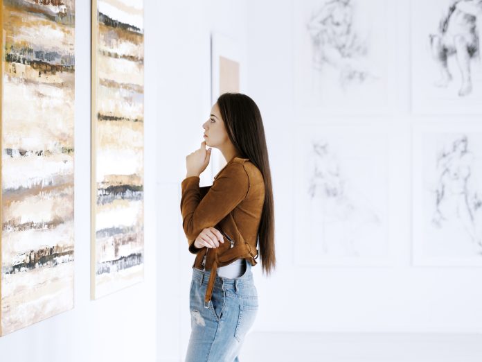 Woman Viewing Art at a Maui Art Gallery