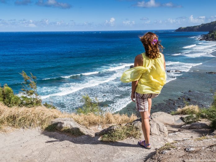 Female sightseeing at a beach on a Maui weekend getaway